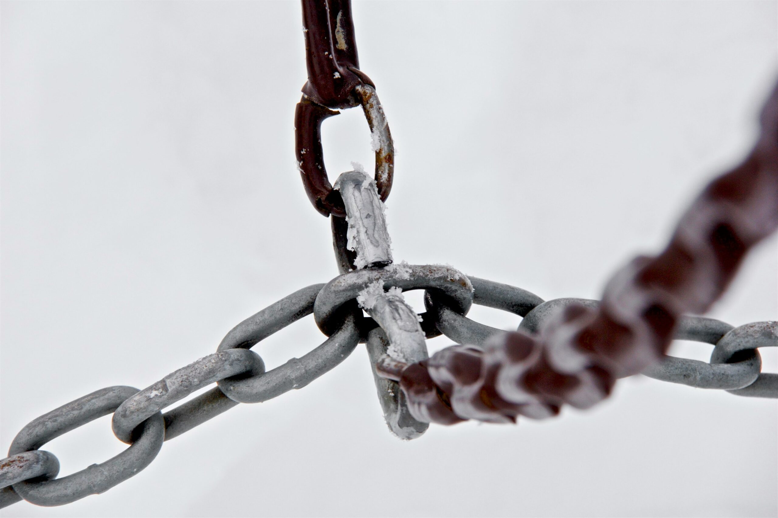 selective focus photograph of gray metal chains